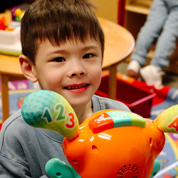 a boy with toys