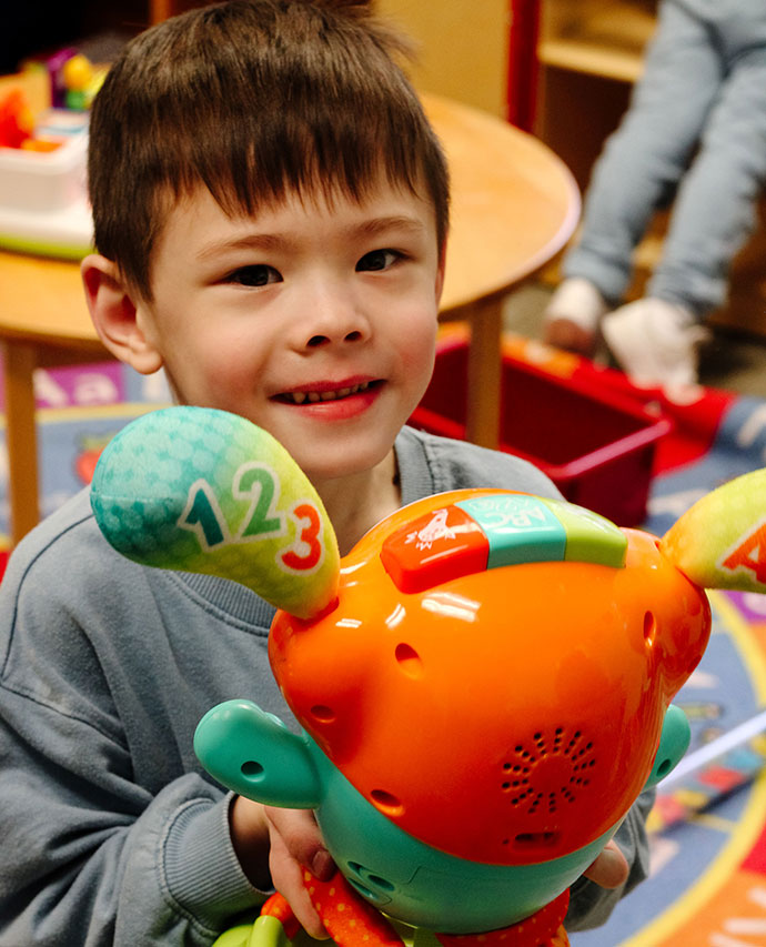 a boy with toys