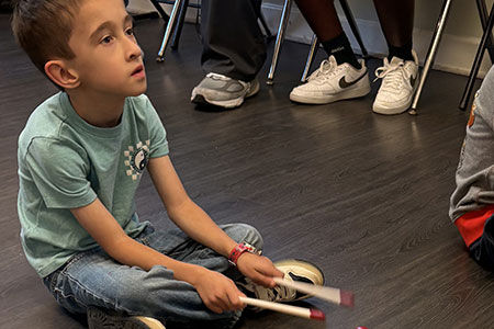 a child is playing a musical instrument
